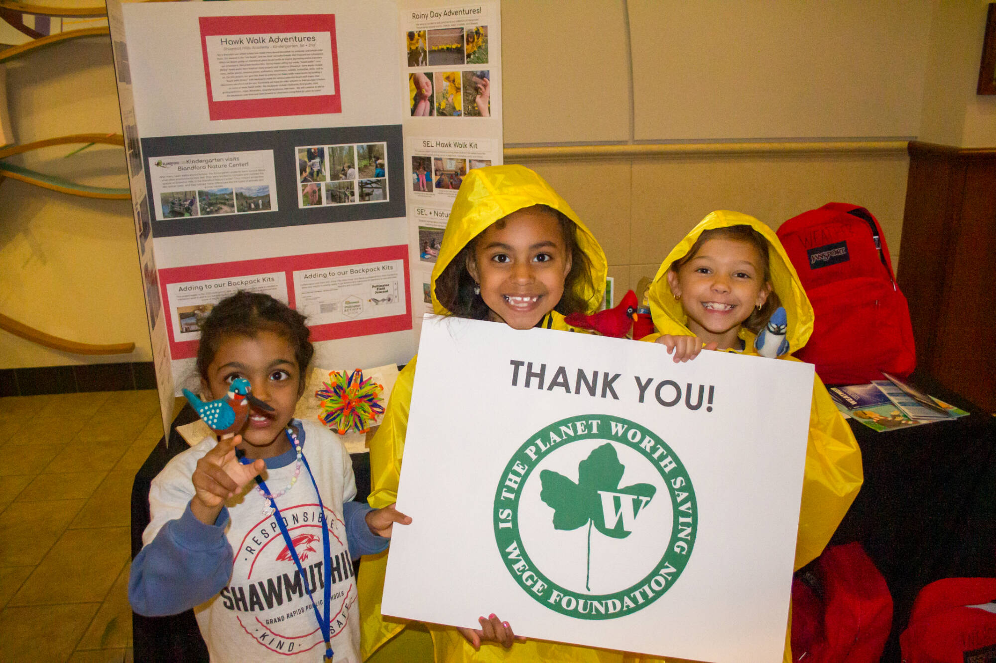 Group of Students Posing with WEGE Foundation Thank You Sign